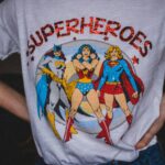 A vibrant superhero themed t-shirt featuring female comic characters in a bold design.