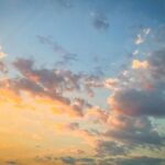 A stunning sunset sky over Kavala, Greece, with vibrant hues and scattered clouds.