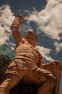 Striking view of the Monumento al Pipila against a cloudy sky in Guanajuato, Mexico.